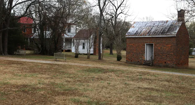 Original Slave Cabin & Smoke House at Brick House | Historic Brattonsville