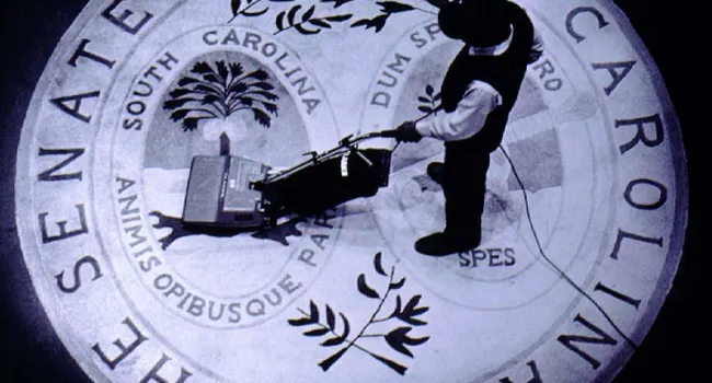 Workman Vacuuming the State Seal | History of SC Slide Collection